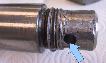 thread of the failed cylinder rod was ground off